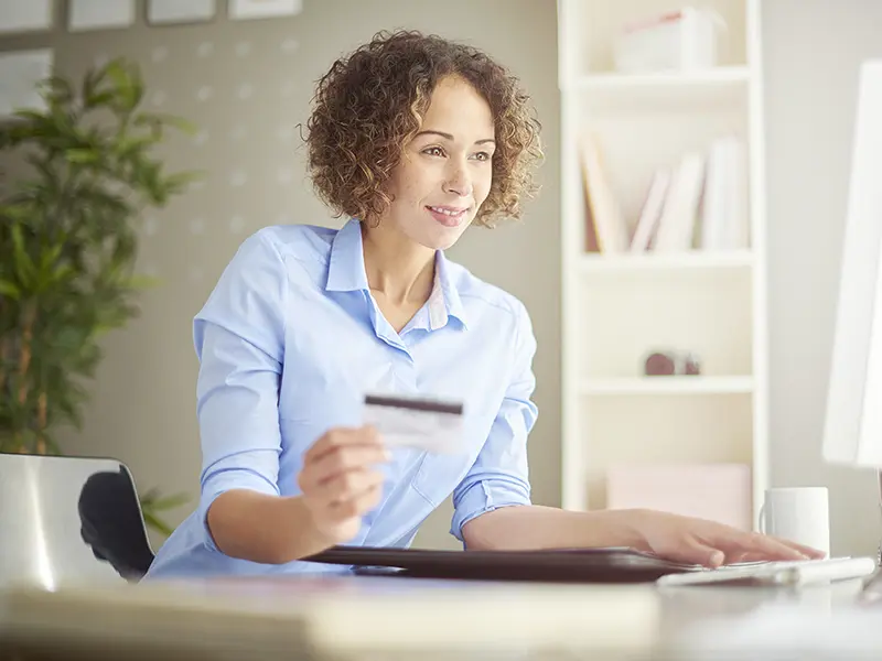 business woman holding credit card